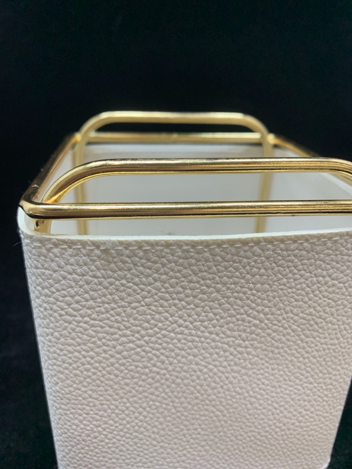 GOLD AND WHITE FAUX LEATHER DESK ORGANIZER.